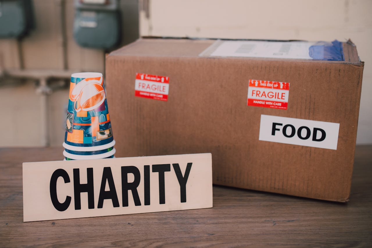 services-img Image of a charity donation box filled with food supplies and paper cups.